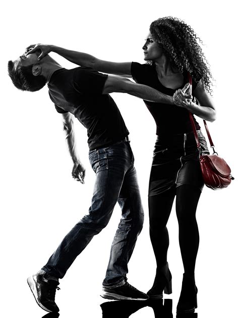 Don't Touch Me! A woman wearing jeans and a handbag hits a man with the heel of her hand.